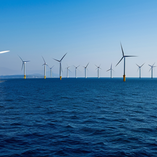 Offshore Wind Farm - Aegean Coast**

"A wide shot of an offshore wind farm off the coast of İzmir, Turkey. Modern wind turbines stand tall against a clear blue sky and calm Aegean Sea. Several fishing boats are visible in the distance, showcasing the coexistence of energy production and traditional livelihoods. Fully clothed fishermen are working. The image should convey clean energy, sustainability, and Turkish ingenuity. safe for work, appropriate content, fully clothed, professional, perfect anatomy, natural proportions, high quality, daytime lighting, realistic."

**